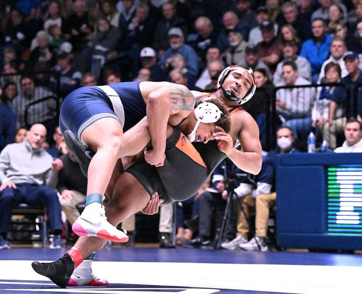 Penn State’s Greg Kerkvliet takes down Oregon State’s J.J. Dixon in the 285-pound bout on Sunday, Dec. 11, 2022 at Rec Hall in State College. Kerkvliet won by a tech fall. Penn State defeated Oregon State, 31-3.