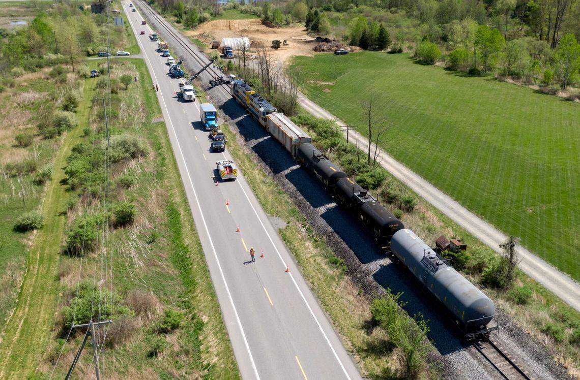 Crews work to clean up the scene after a dump truck was hit by a train on Thursday, May 2, 2024 in Worth Township.