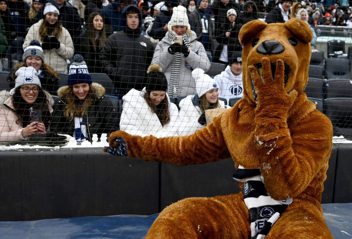 The Penn State Nittany Lions points to a few mini snowmen he made during the Pinstripe Bowl at Yankee Stadium on Saturday, Dec. 27, 2025.  