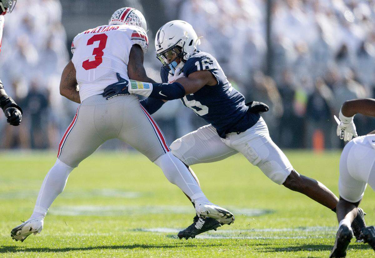 Penn State safety Ji’Ayir Brown reaches to stop Ohio State’s Miyan Williams during the game on Saturday, Oct. 29, 2022.