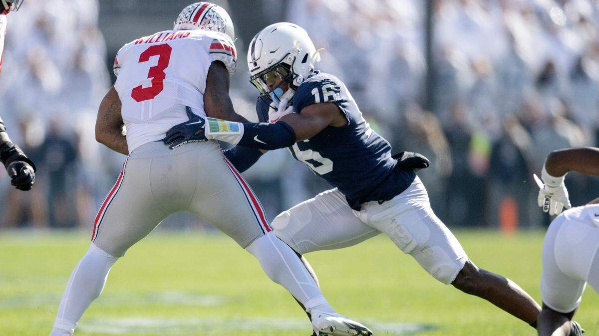 Penn State safety Ji’Ayir Brown reaches to stop Ohio State’s Miyan Williams during the game on Saturday, Oct. 29, 2022.