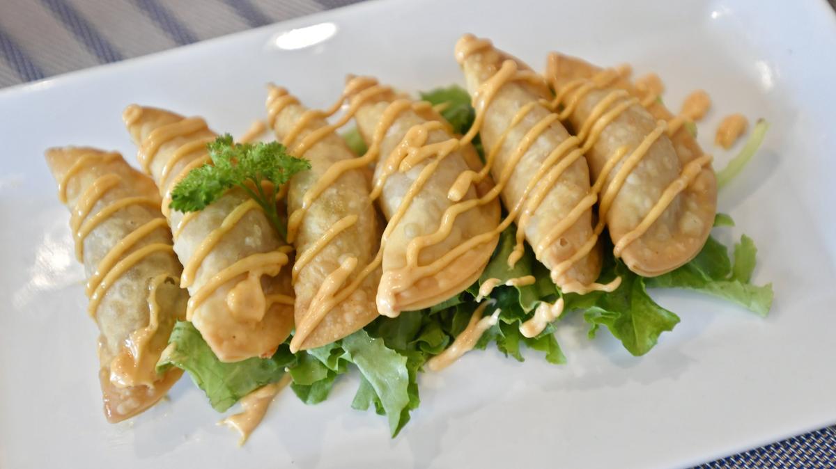 Bacon Cheeseburger Dumplings are served at the new restaurant Bistrozine, located at 409 E. Calder Way.