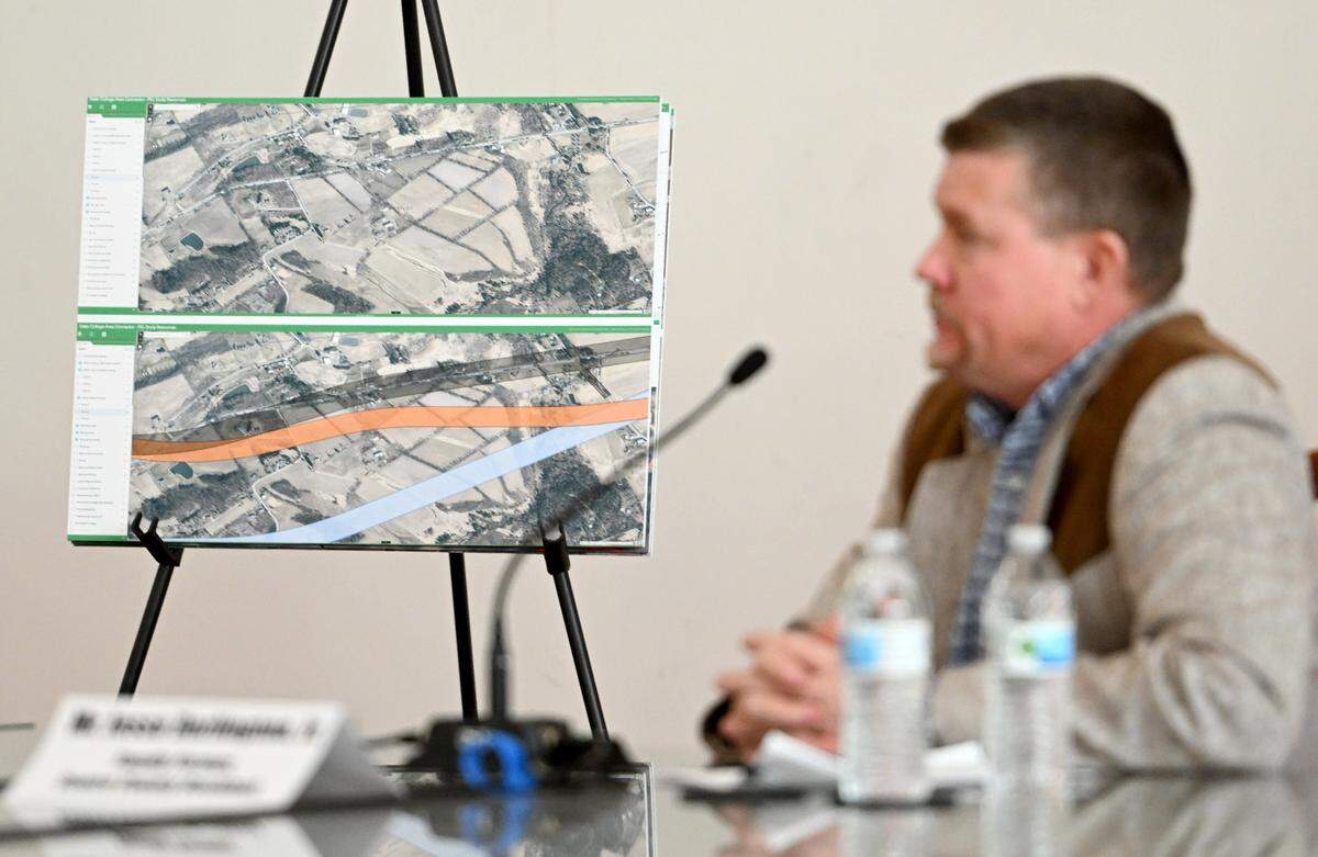 A poster shows the possible paths for the State College Area Connector project that would go through the Darlington family farm. Jesse Darlington talked about the issue during a public hearing hosted by state Sen. Cris Dush, R-Brookville, on Monday, Jan. 22, 2024.