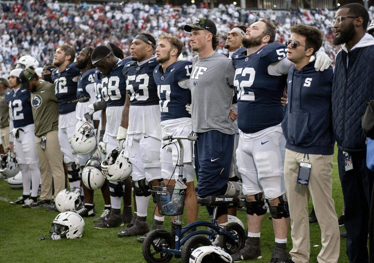 Penn State quarterback Ethan Grunkemeyer (17) stands with Drew Allar and his teammates for the alma mater after the loss to Indiana on Saturday, Nov. 8, 2025.