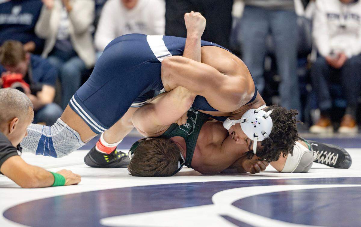 Penn State’s Carter Starocci rolls Michigan State’s Ryan Boucher in the 184 lb bout of the match on Friday, Jan. 10, 2025 in Rec Hall.
