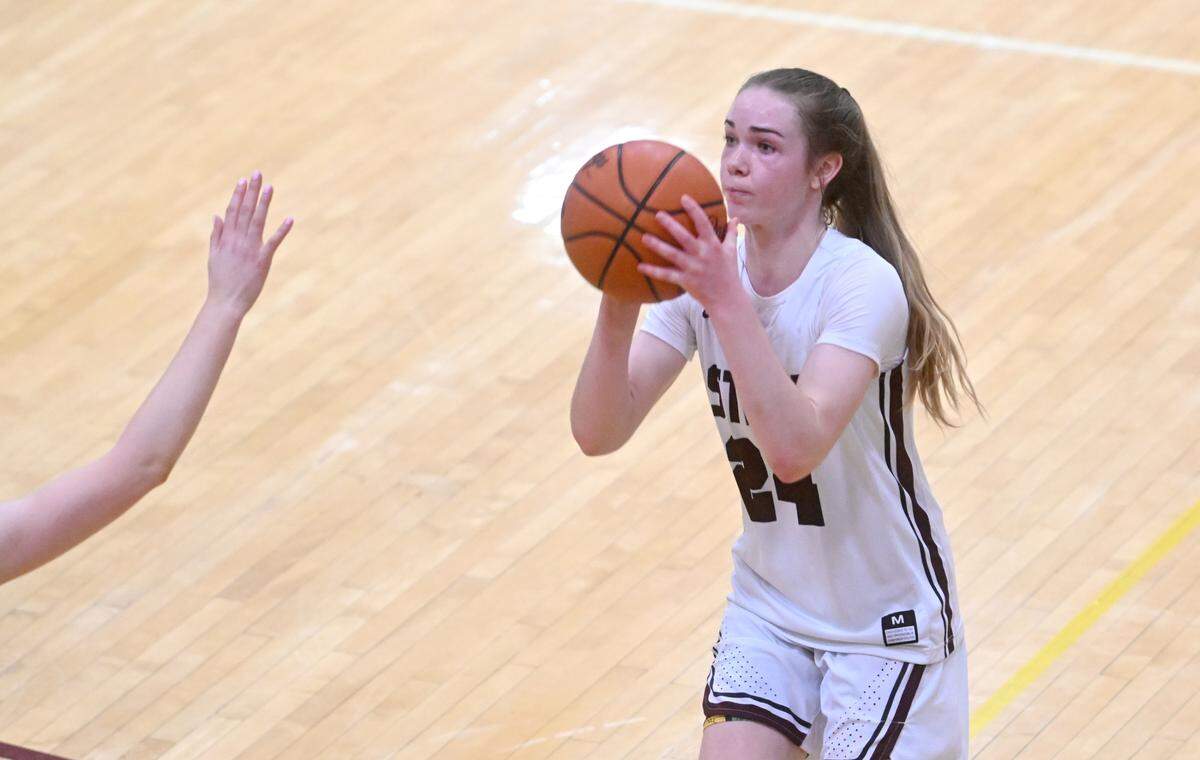 State College’s Jordyn Steindl shoots for a three over a Cumberland Valley defender during the game on Tuesday, Jan, 24, 2023.