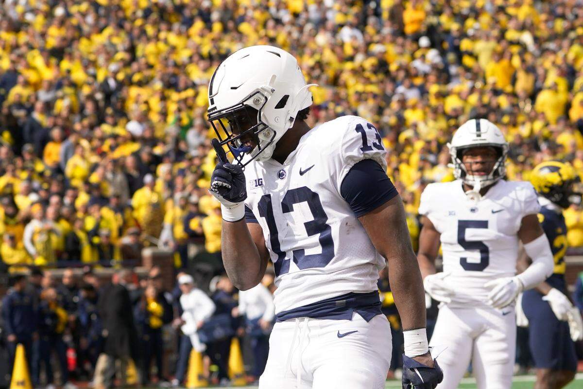 Penn State running back Kaytron Allen (13) celebrates his one-yard touchdown run against Michigan in the first half of an NCAA college football game in Ann Arbor, Mich., Saturday, Oct. 15, 2022.