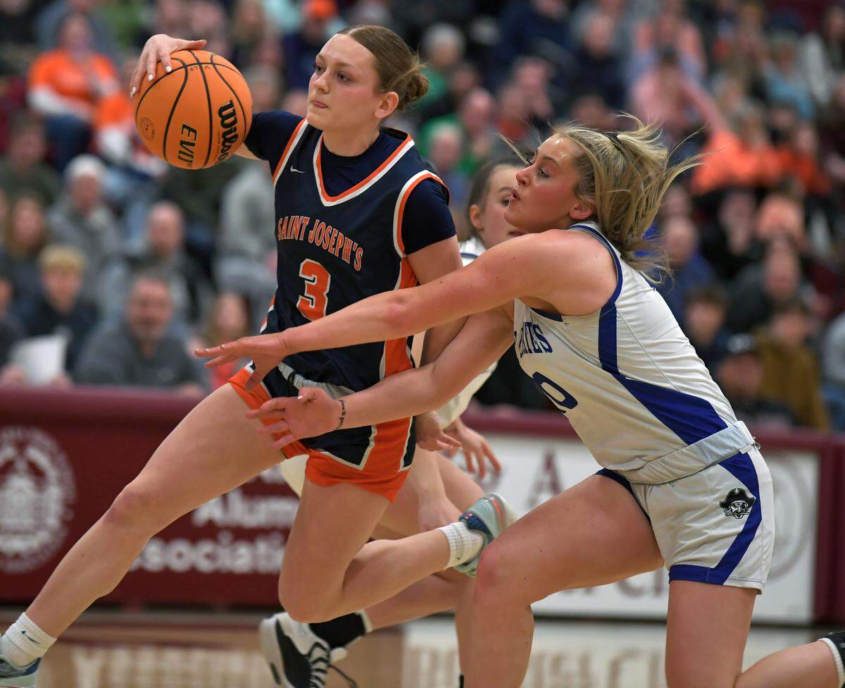 St. Joseph Academy's Naomi Crispin advances the ball past Williamsburg's LeeAnna Royer during the PIAA Class A semifinal game Tuesday, March 17, 2026 at Altoona Area High School.