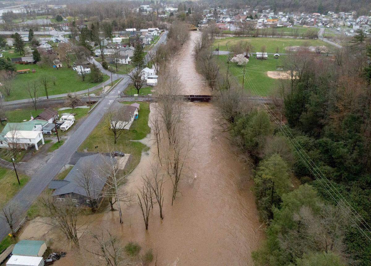 Moose Run in Milesburg starts to flood toward homes on Front Street on Wednesday, April 3, 2024.