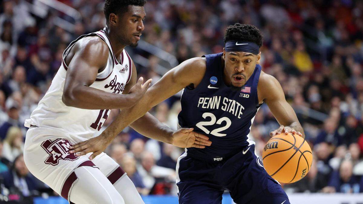 Penn State Nittany Lions guard Jalen Pickett (22) dribbles the ball against Texas A&M Aggies guard Davin Watkins (22) during the first half of Thursday’s game at Wells Fargo Arena.