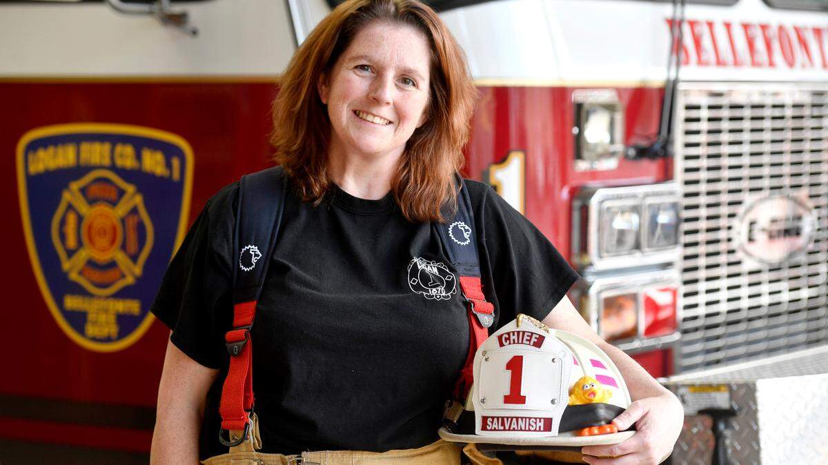 Logan Fire Company Chief Bobbi Salvanish stands next to Rescue 1 at the station on Wednesday, March 16, 2022.