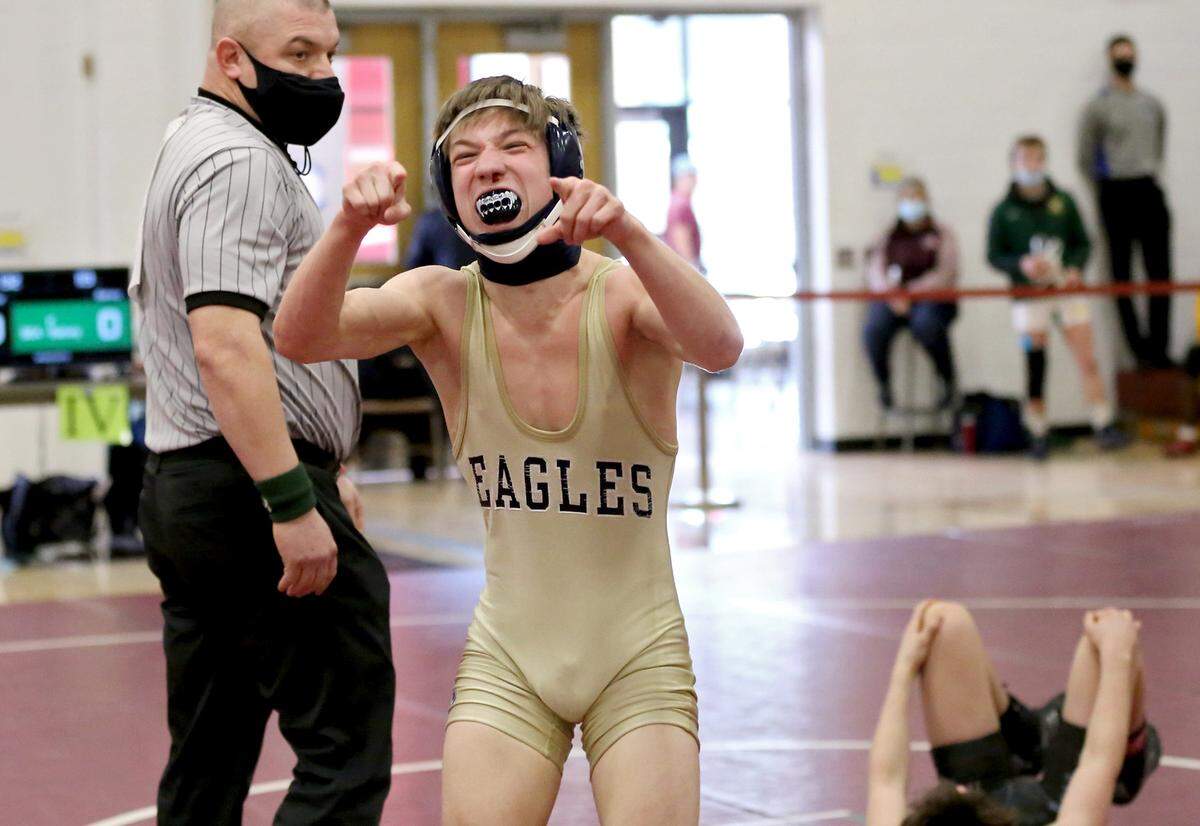Bald Eagle Area’s Coen Bainey celebrates his win in the 113-pound championship bout at the District 6 AA wrestling on Saturday, Feb. 20, 2021.