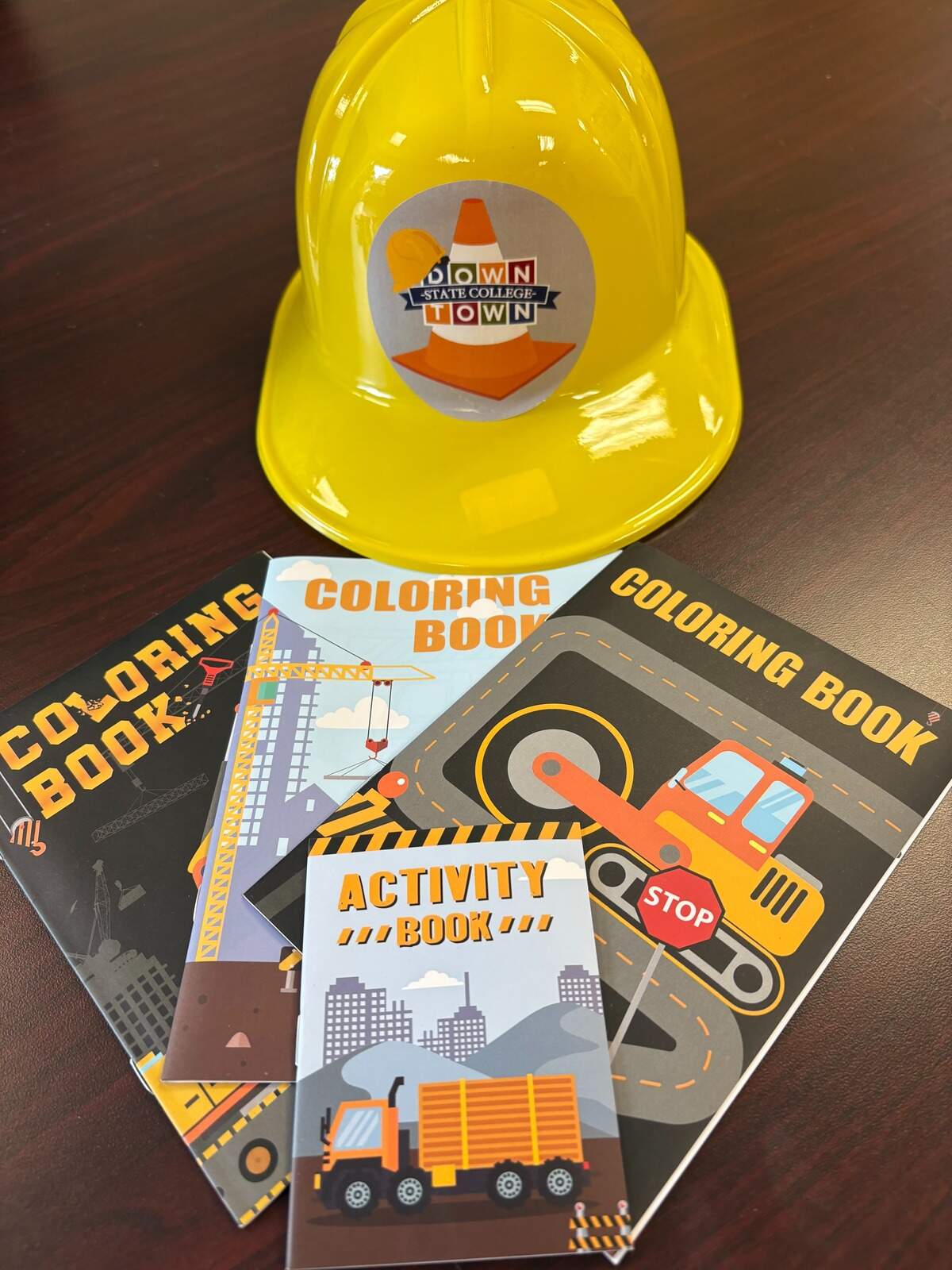 A closer look at the free hard hats and activity books that will be given out as part of the “Calder Way Construction Crawl” that kicks off Monday and continues through July.