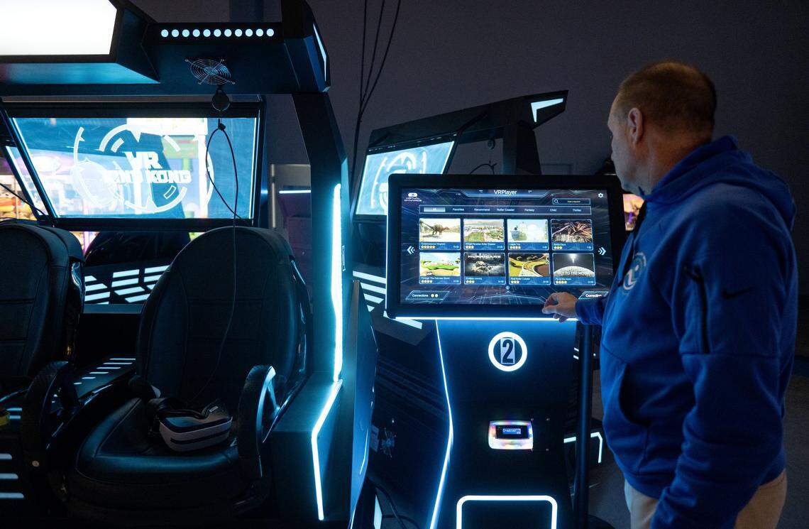 Michael Lee talks about the variety of virtual reality experiences on one of the games at The Clubhouse Family Fun Centre at Nittany Valley Sports Centre on Thursday, March 5, 2026. 