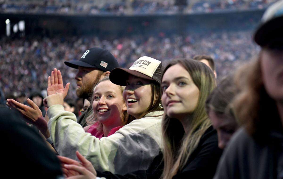 Fans sing along with Mitchell Tenpenny as he performs at Beaver Stadium before Luke Combs on Saturday, April 27, 2024.