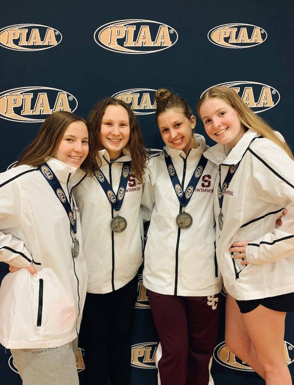 State College swimming’s girls’ 200-yard medley relay team poses for a picture after securing a silver medal at the PIAA Class 3A State Swimming and Diving Championships on March 20, 2021.