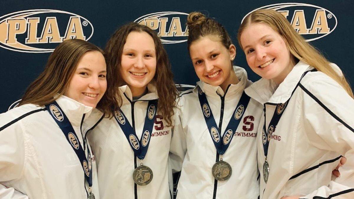 State College swimming’s girls 200-yard medley relay team poses for a picture after securing a silver medal at the PIAA Class 3A State Swimming and Diving Championships on March 20, 2021.