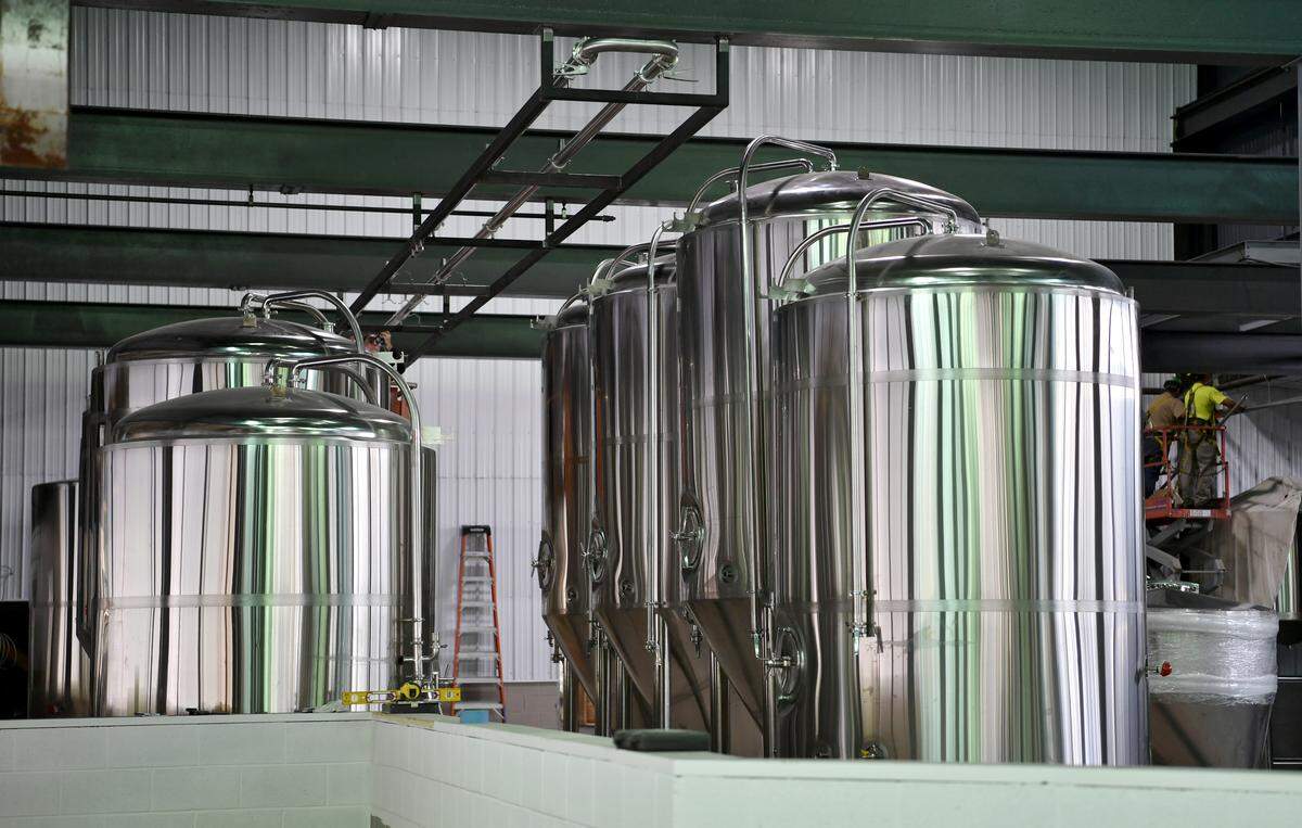 The fermenters and brew tanks are being installed at Axemann Brewery, which is converting one of the old mills at the Titan Park into a brewery and tasting room.