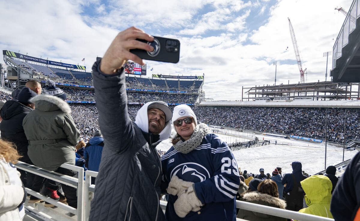 Ryan and Katie Laubach take a selfie as they enjoy the Penn State men’s hockey game against Michigan State at Beaver Stadium on Saturday, Jan. 31, 2026.
