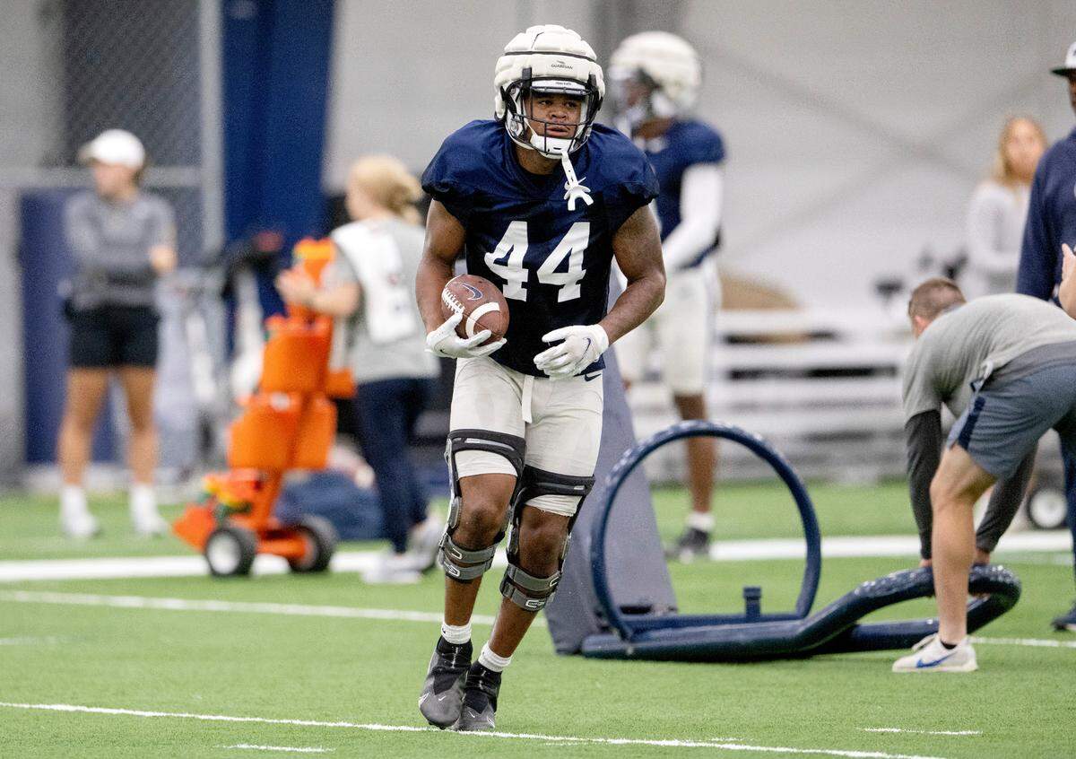 Penn State defensive end Chop Robinson runs a drill during practice on Wednesday, Sept. 7, 2022.