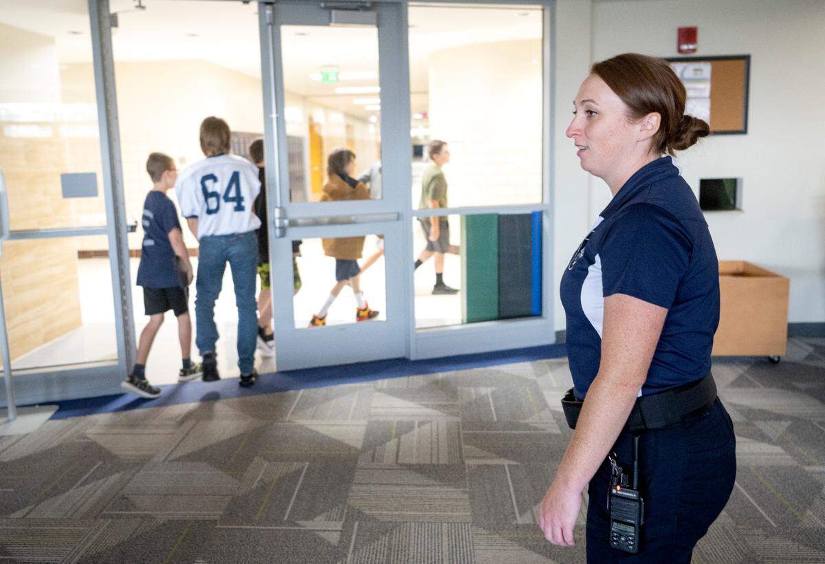 Penns Valley Area School District police officer Nicole Eckley talks with students as they leave the library on Thursday, Sept. 7, 2023.