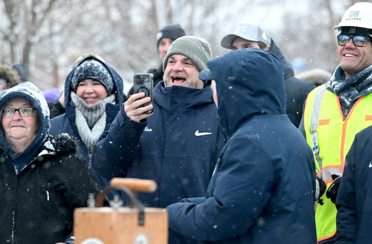 Penn State athletic director Pat Kraft films as the crowd waits for the press box at Beaver Stadium to come down on Saturday, Jan. 4, 2025.