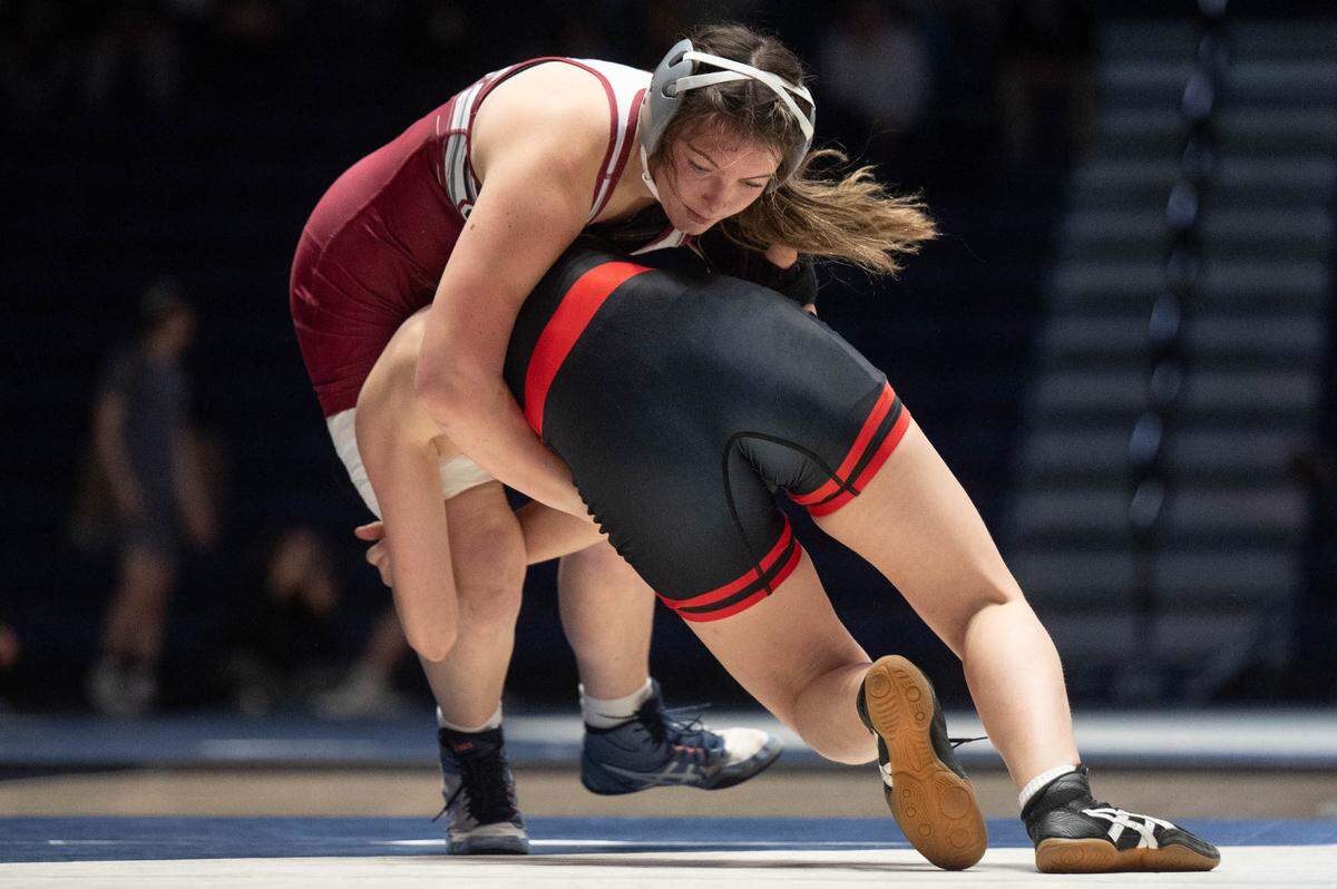 State High’s Isabelle Dubler, top, wrestles an opponent from Clearfield during a dual meet at Rec Hall on Tuesday, Dec. 17, 2024.