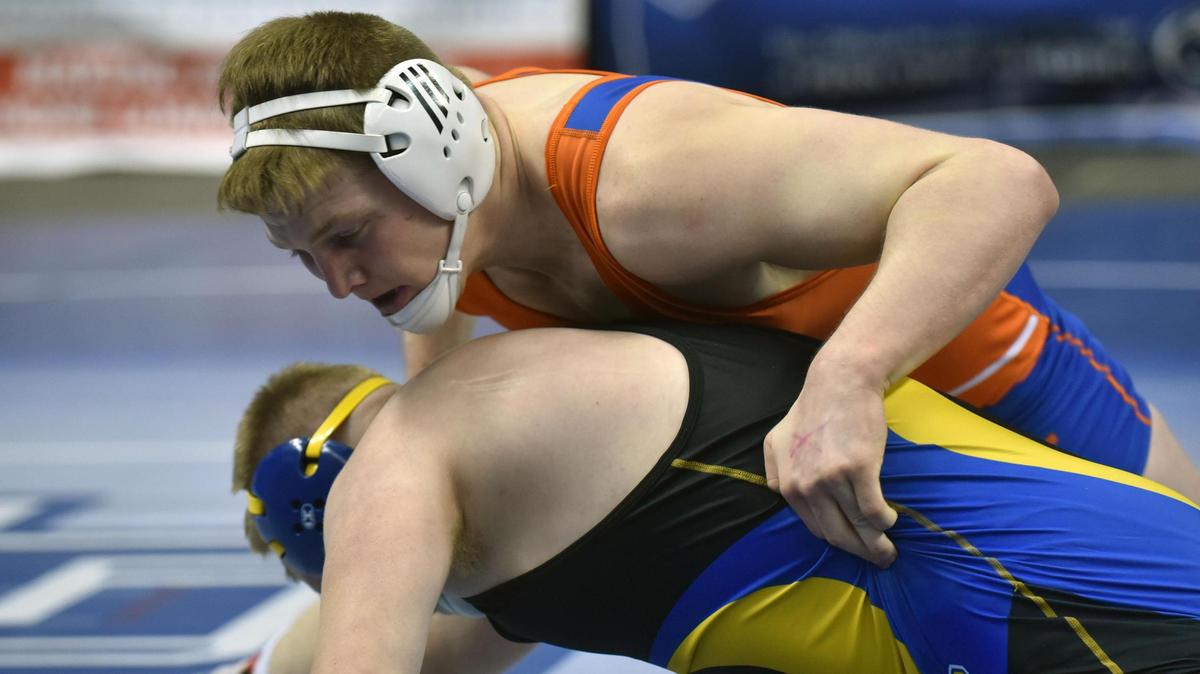 St. Joseph’s Catholic Academy’s Kolby Franklin (195 pounds), top, advanced to the quarterfinals of the Class 2A PIAA Wrestling Championships after earning a dominant 23-9 major decision over Bellwood’s Trent Whaley on Thursday at Hershey’s Giant Center.