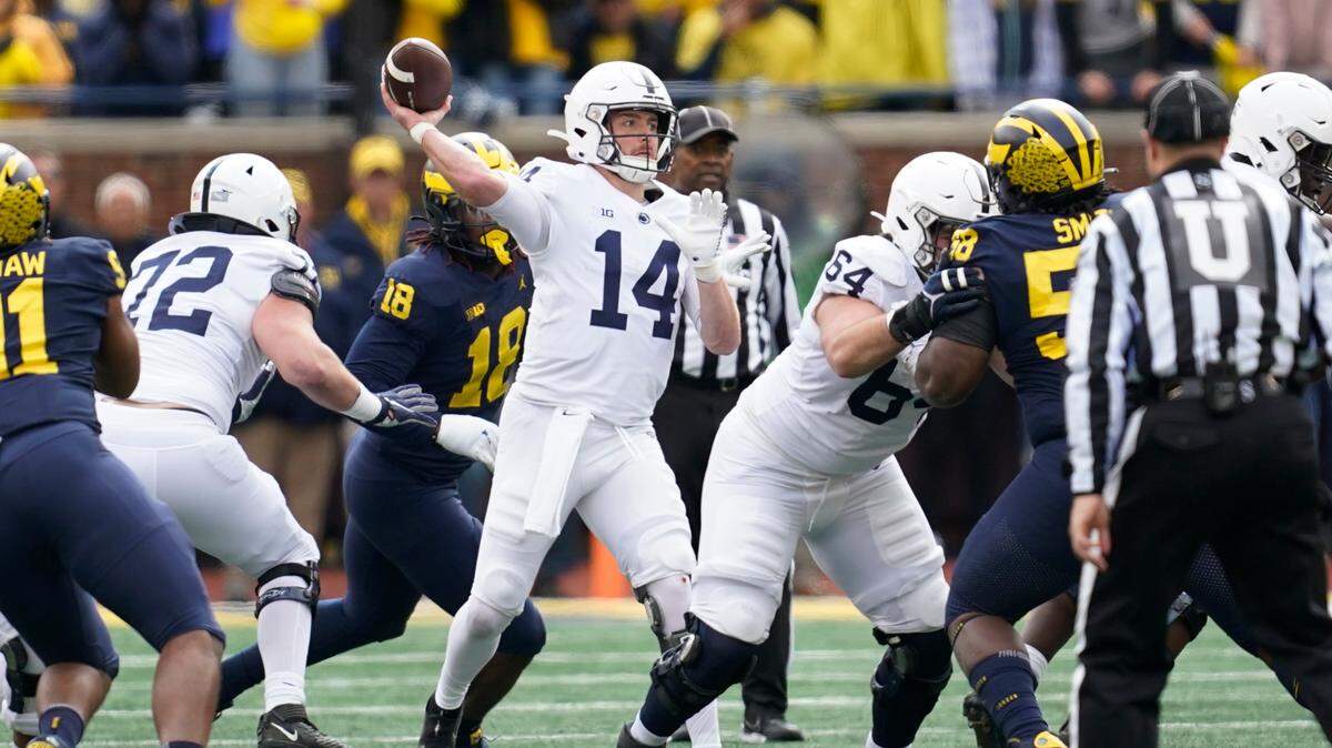 Penn State quarterback Sean Clifford (14) throws against Michigan during Saturday’s game.