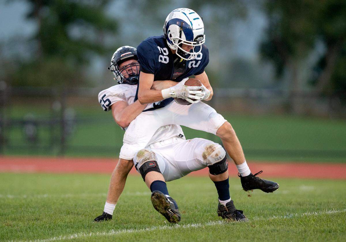 Philipsburg-Osceola’s Josiah Kephart stops Penns Valley’s Miles Brooks during the game on Friday, Sept. 17, 2021.