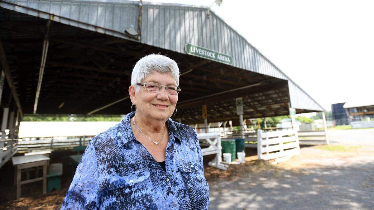 Wanda Decker smiles for a portrait Wednesday, July 26, 2018 at the Grange fairgrounds in Centre Hall. Decker has volunteered at the Grange Fair for 35 years and handles the process of inputting fair entries and reporting show and sale results.