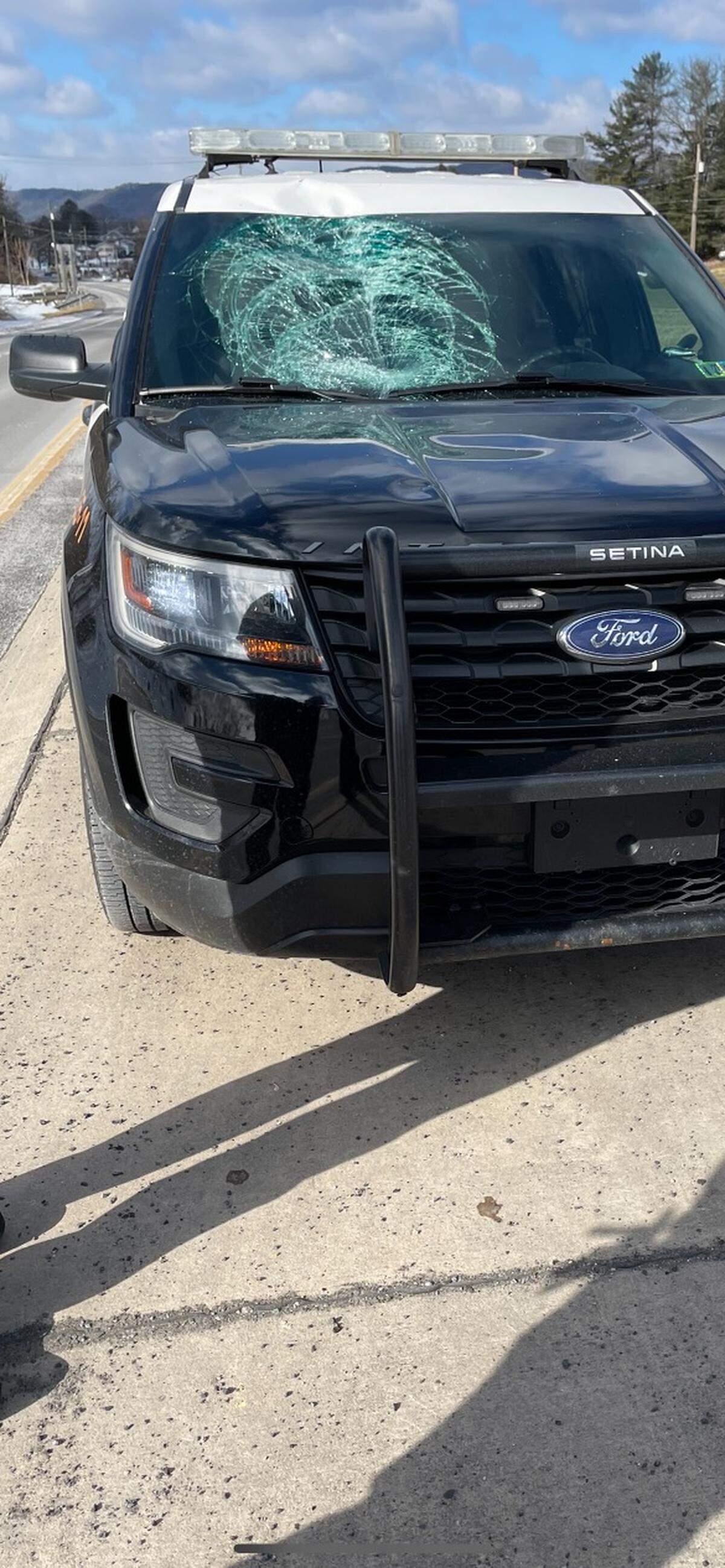 A pair of Spring Township police officers avoided injury Monday after a tire detached from a pickup truck and smashed into the windshield of their SUV.