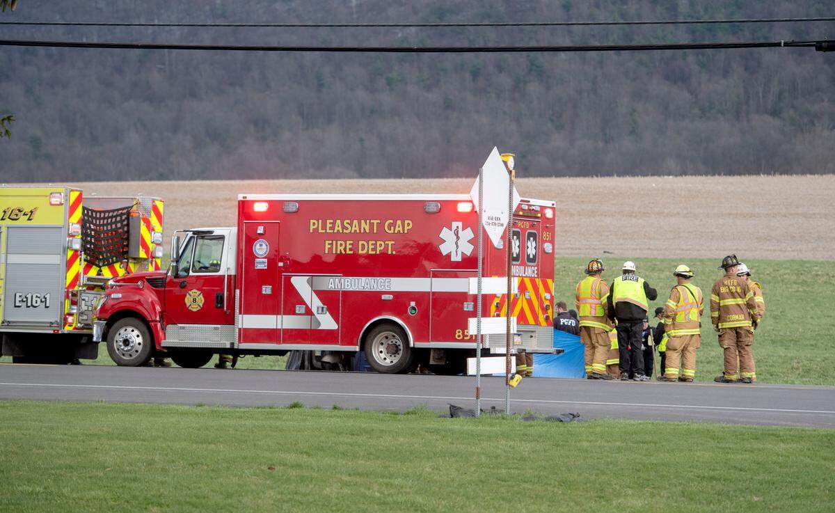 Emergency personnel respond to a crash on state Route 64 between an all-terrain vehicle and another vehicle on Tuesday.