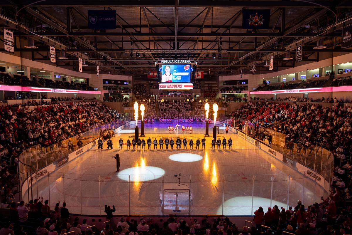 Flames rise as Wisconsin goaltender Ava McNaughton is introduced before the women’s Frozen Four game between Penn State and Wisconsin in Pegula Ice rAena in University Park on Friday, March 20, 2026. 