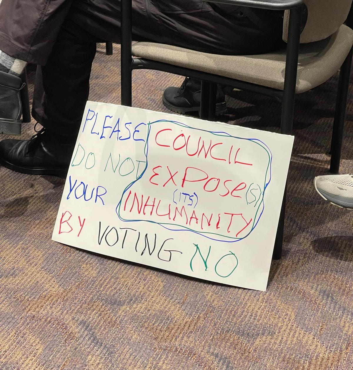 One of the many signs people brought to the State College Borough Council meeting Wednesday where the council unanimously approved passing a resolution calling for a cease-fire in the Israel-Hamas war.