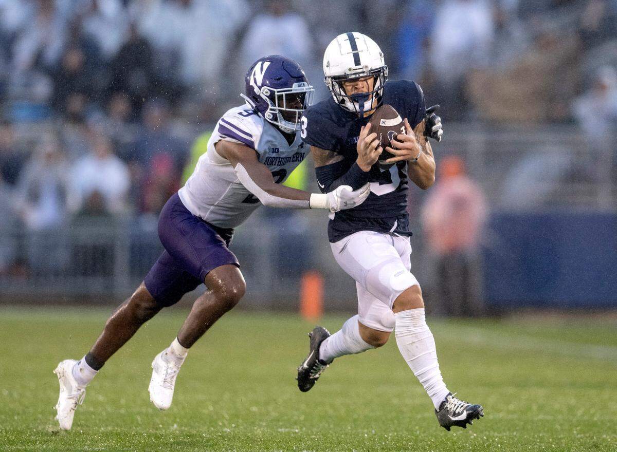 Penn State wide receiver Parker Washington makes a catch ahead of Northwestern’s Jeremiah Lewis during the game on Saturday, Oct. 1, 2022.