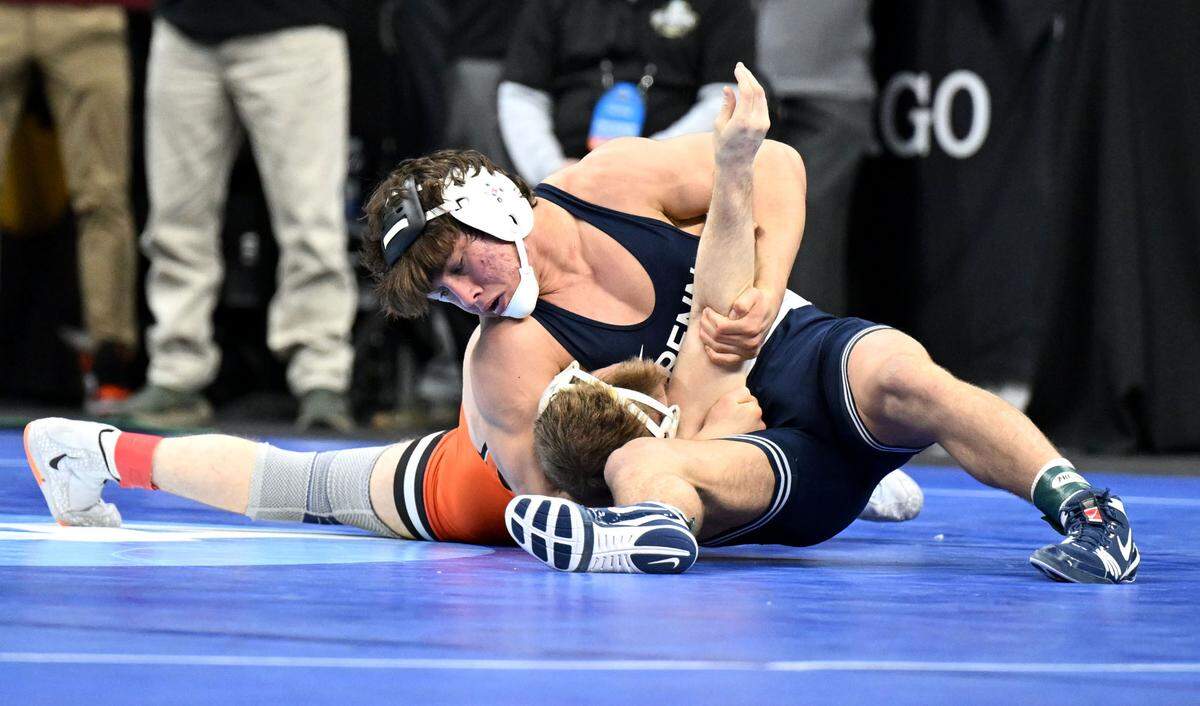 Penn State’s Tyler Kasak pins Oklahoma State’s Caleb Fish I’m a 157-pound bout at the 2025 NCAA Wrestling Championships in Philadelphia on Friday, March 21, 2025.