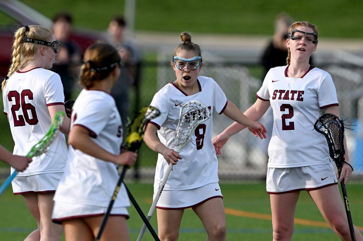 State College’s Mia Reese is congratulated by teammates after scoring a goal in the game against CD East on Thursday, April 20, 2023.