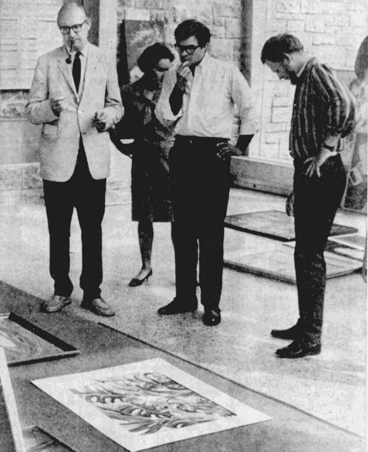 Judges contemplate entries in the Festival Exhibition, which was part of the first-ever Central Pennsylvania Festival of the Arts in July 1967. Campus galleries with selected entries and winners were opened to the public within a day or two after this photo was taken.