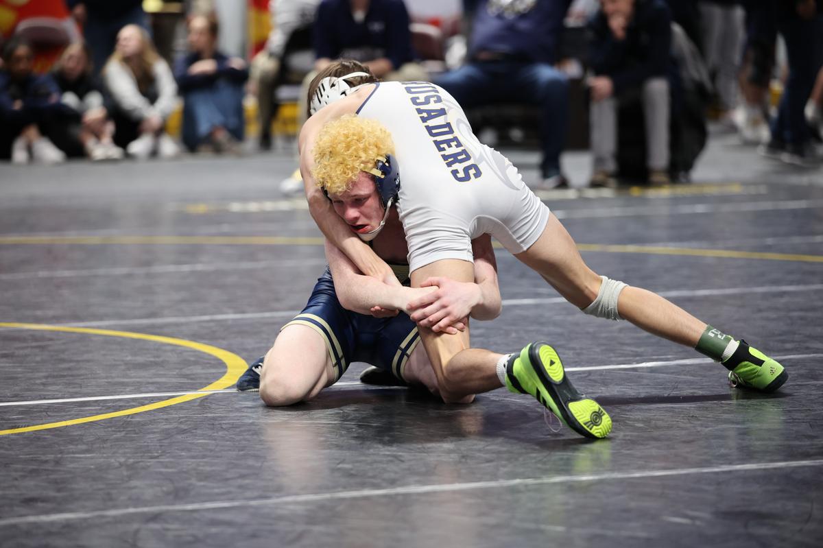 Bald Eagle Area’s Dawson Lomison aims to finish off a takedown of Notre Dame Green Pond’s Tanner Berkenstock in their 127-pound bout of the Eagles’ 41-16 loss on Thursday in the PIAA Class 2A dual championships first round. Berkenstock edged Lomison, 2-0, in sudden victory.