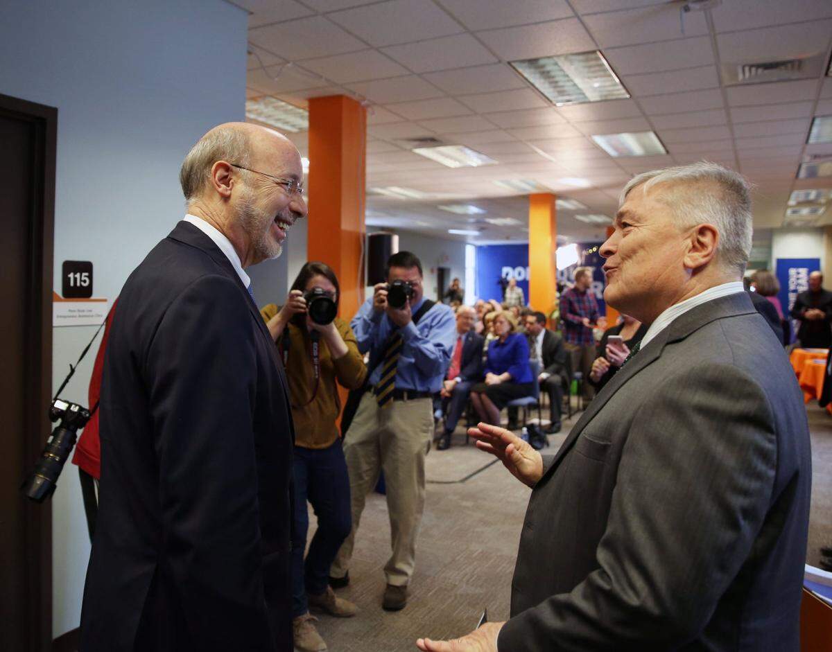 Pennsylvania Governor Tom Wolf, left, and Penn State President Eric Barron speak before the Governor’s speech Monday, Feb. 13, 2017 at Happy Valley Launch Box.