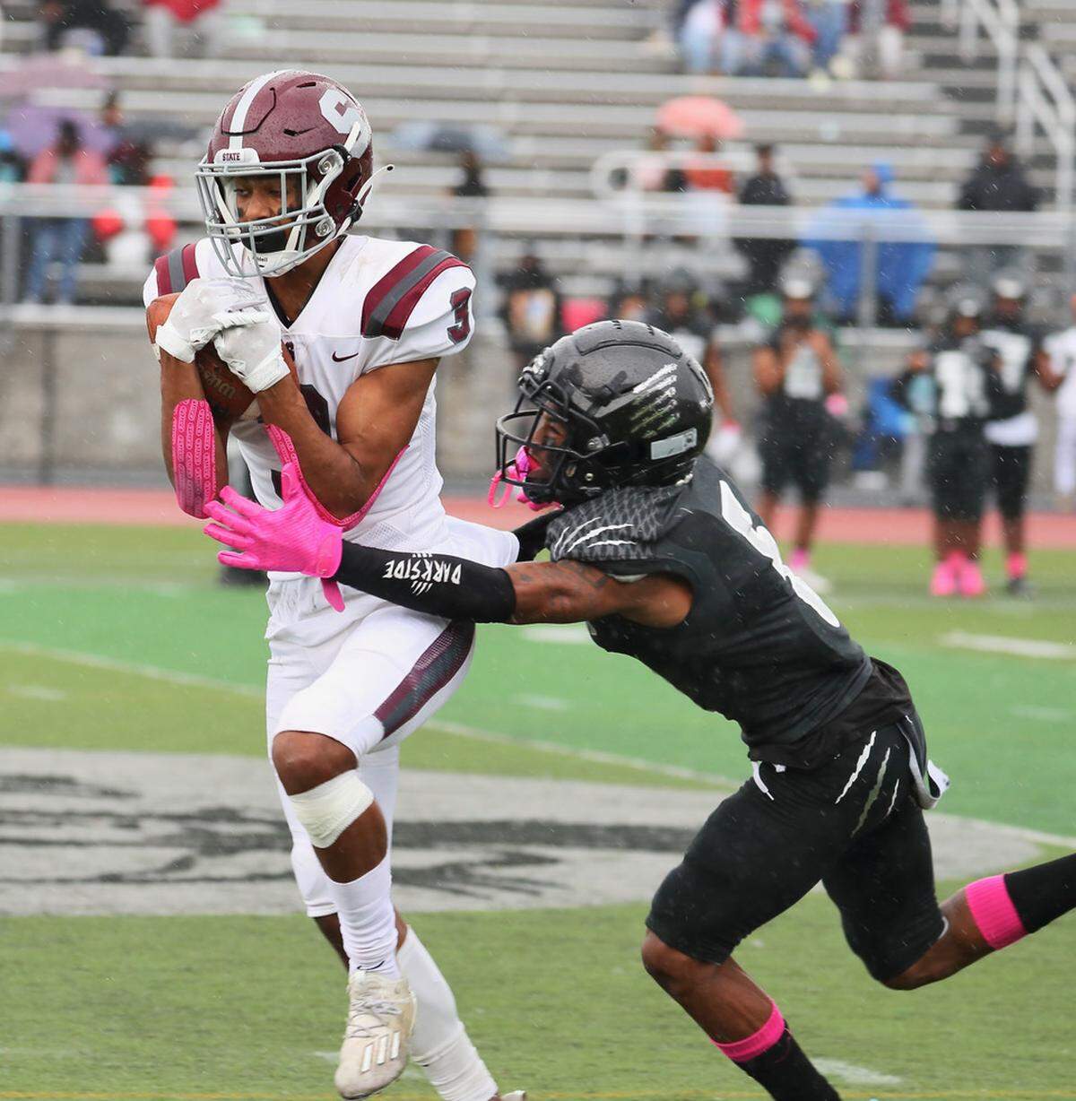 State College’s Jashaun Green runs with the ball against Harrisburg on Saturday, Oct. 23, 2021. State College lost 15-13.