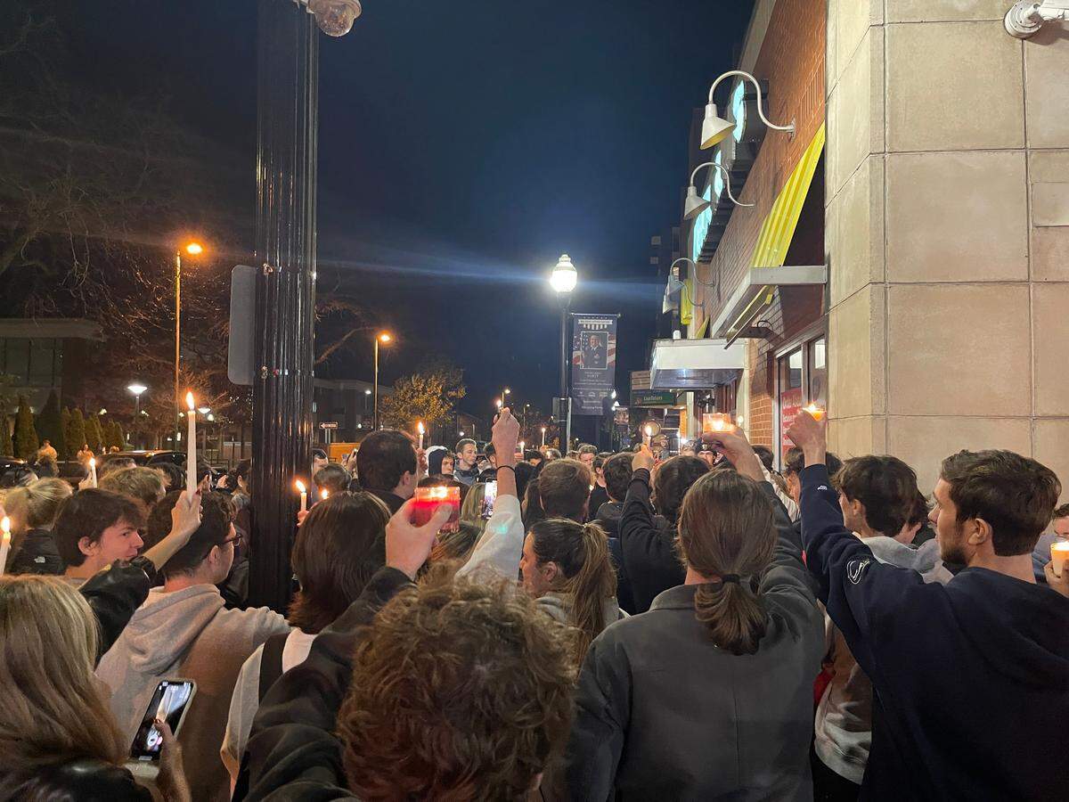 Penn State students gathered Sunday evening for a “candlelight vigil” after the downtown State College McDonald’s closed.