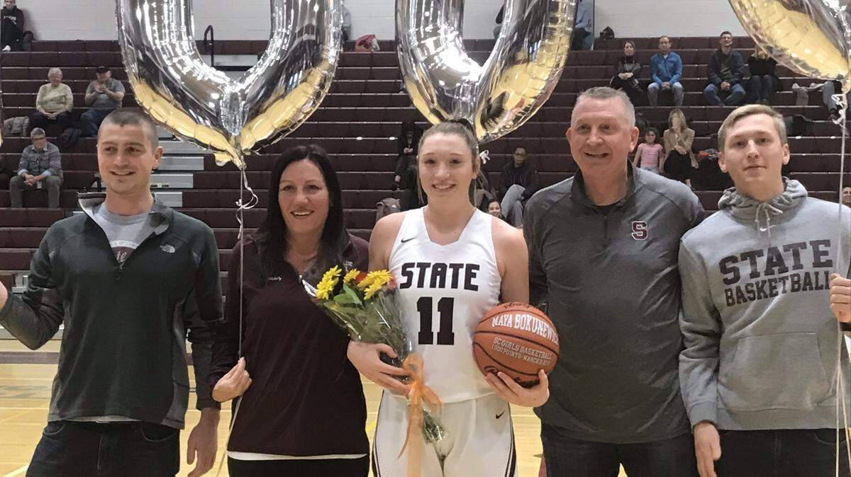 State College’s Maya Bokunewicz is honored before Tuesday’s home opener for scoring her 1,000th career point.