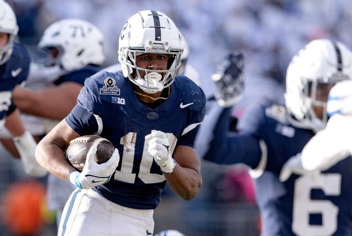 Penn State running back Nick Singleton runs with the ball from SMU defenders during the game on Saturday, Dec. 21, 2024 at Beaver Stadium.