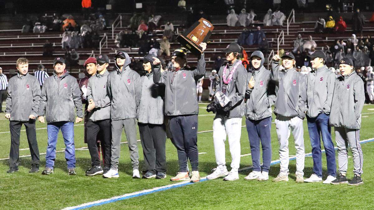 State College’s boys golf team shows off its PIAA team championship trophy on Friday, Oct. 29, 2021, at Memorial Field.
