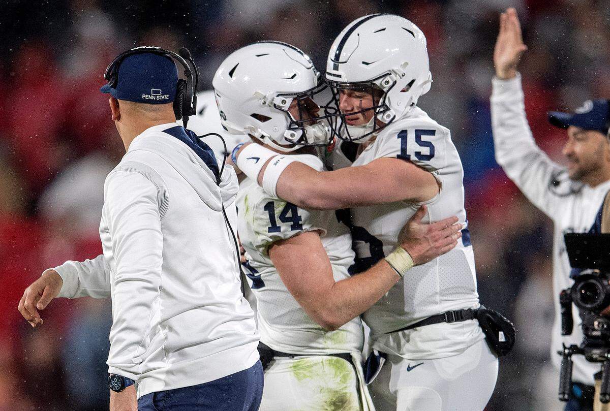 Penn State quarterback Sean Clifford is hugged by teammate Drew Allar as Clifford leaves the game and Allar enters in the fourth quarter of the Rose Bowl game against Utah on Monday, Jan. 2, 2023.