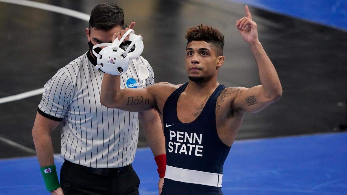 Penn State’s Roman Bravo-Young celebrates after defeating Virginia Tech’s Korbin Myers during their 133-pound match in the semifinal round of the NCAA wrestling championships Friday, March 19, 2021, in St. Louis.