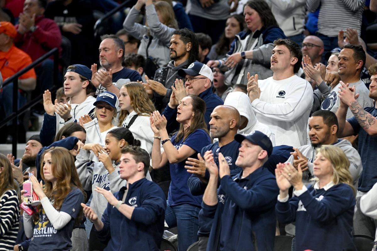 Penn State fans cheer after Josh Barr’s overtime win over Oregon State’s Trey Munoz during the 2025 NCAA Wrestling Championships in Philadelphia on Thursday, March 20, 2025.