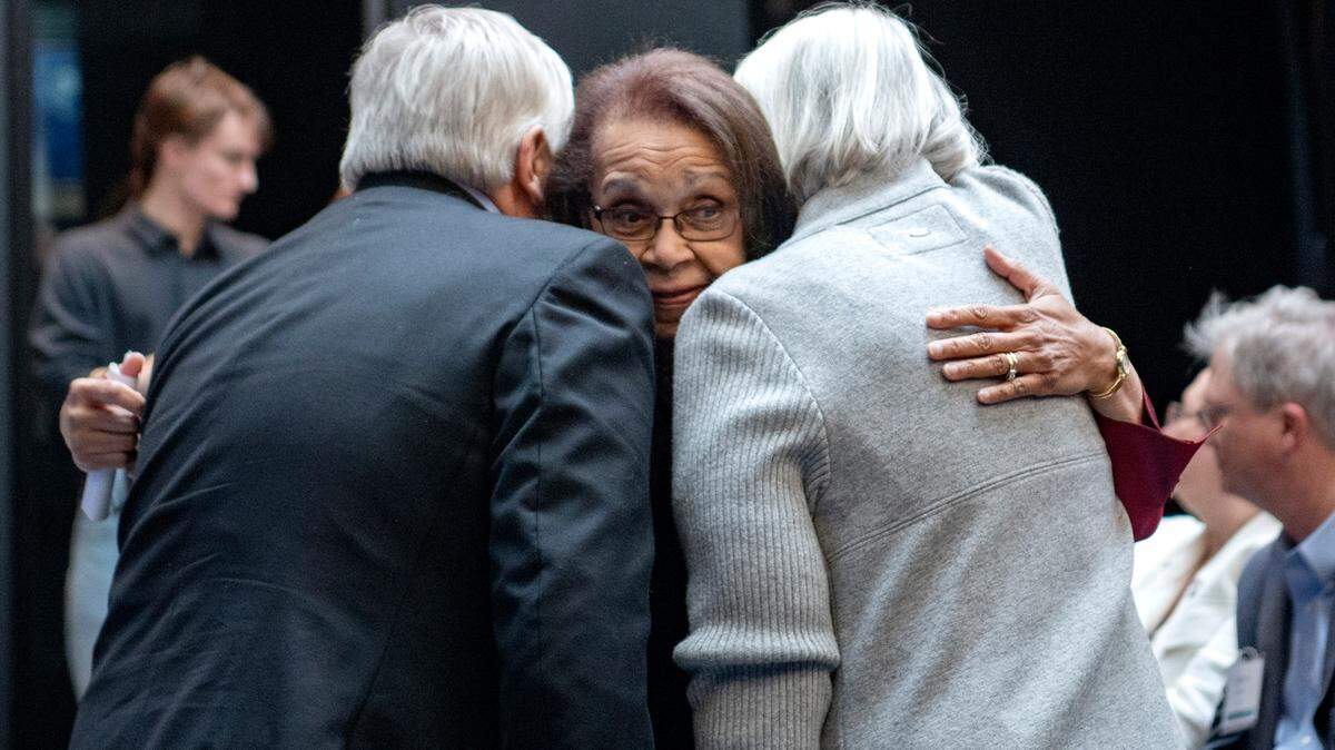 Shirley M. Malcom hugs Penn State president Eric Barron and his wife Molly Friday after a ceremony to honor Malcom. The 329 Building at Innovation Park has been renamed the “Shirley M. Malcom Building.”
